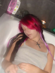 Emo babe acquires naked in a tub