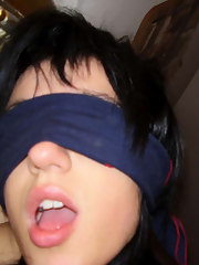 Blindfolded bitch engulfing on a boner