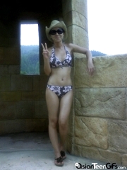 Oriental lass wearing a bikini on her vacation