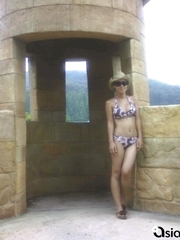 Oriental lass wearing a bikini on her vacation